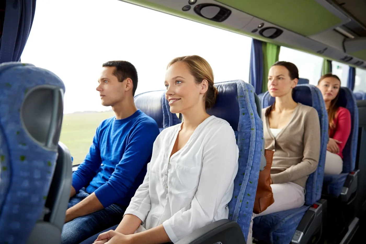 Passengers seated together on a Hervey Bay Shuttle Bus Service charter coach travelling to an event