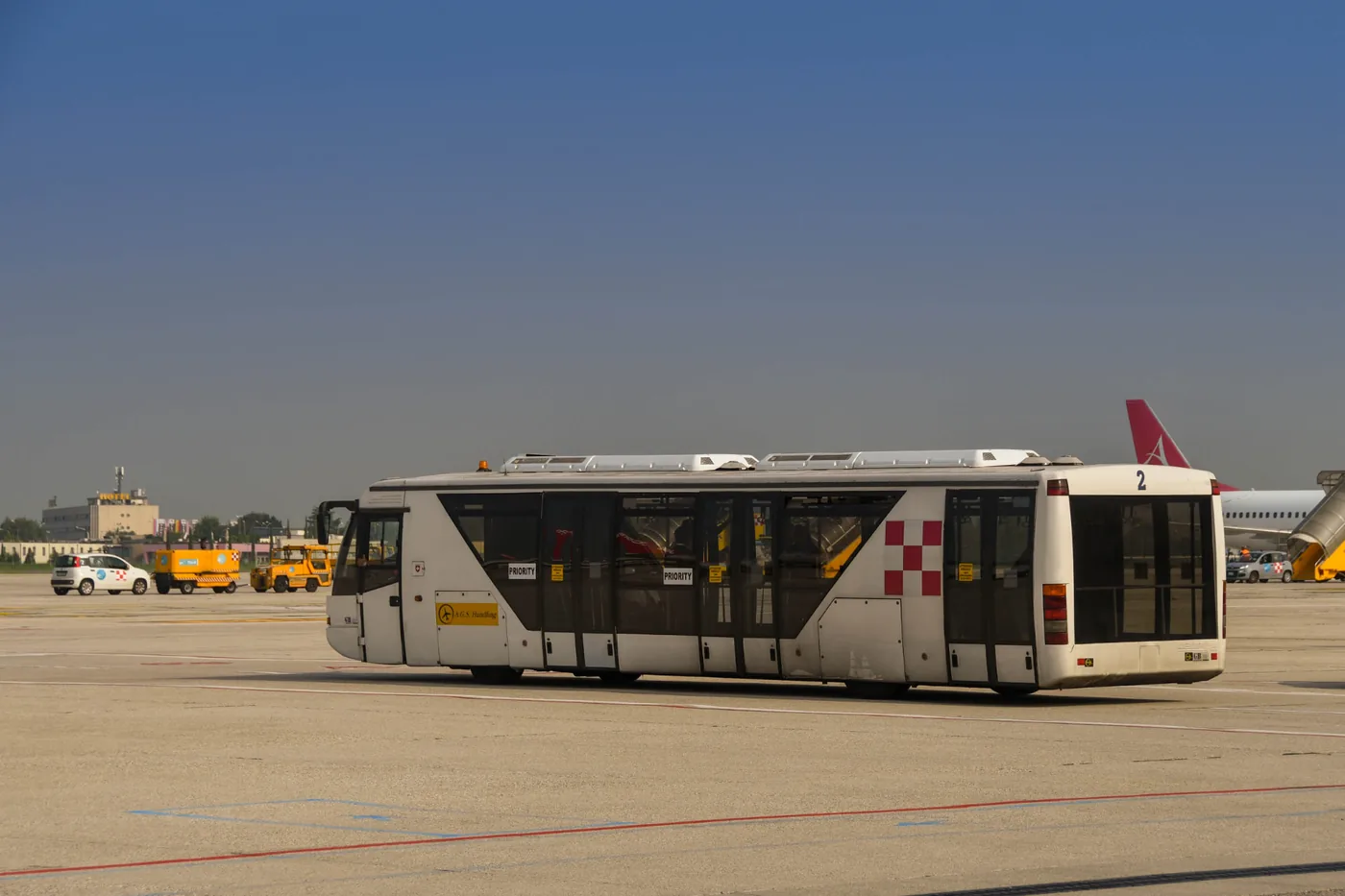 Airport shuttle bus on the tarmac collecting FIFO workers travelling from Hervey Bay to Brisbane